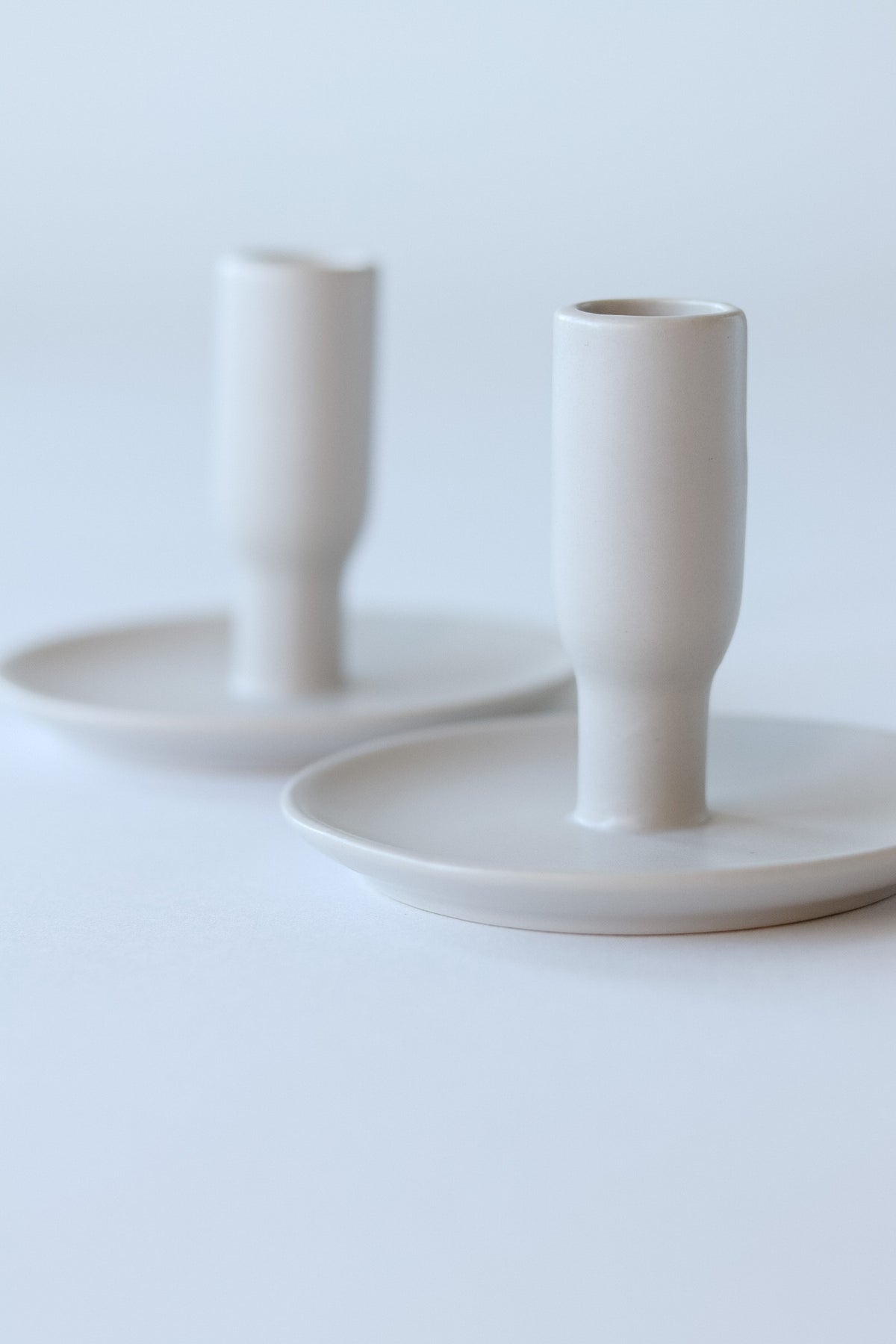 white porcelain candle holders