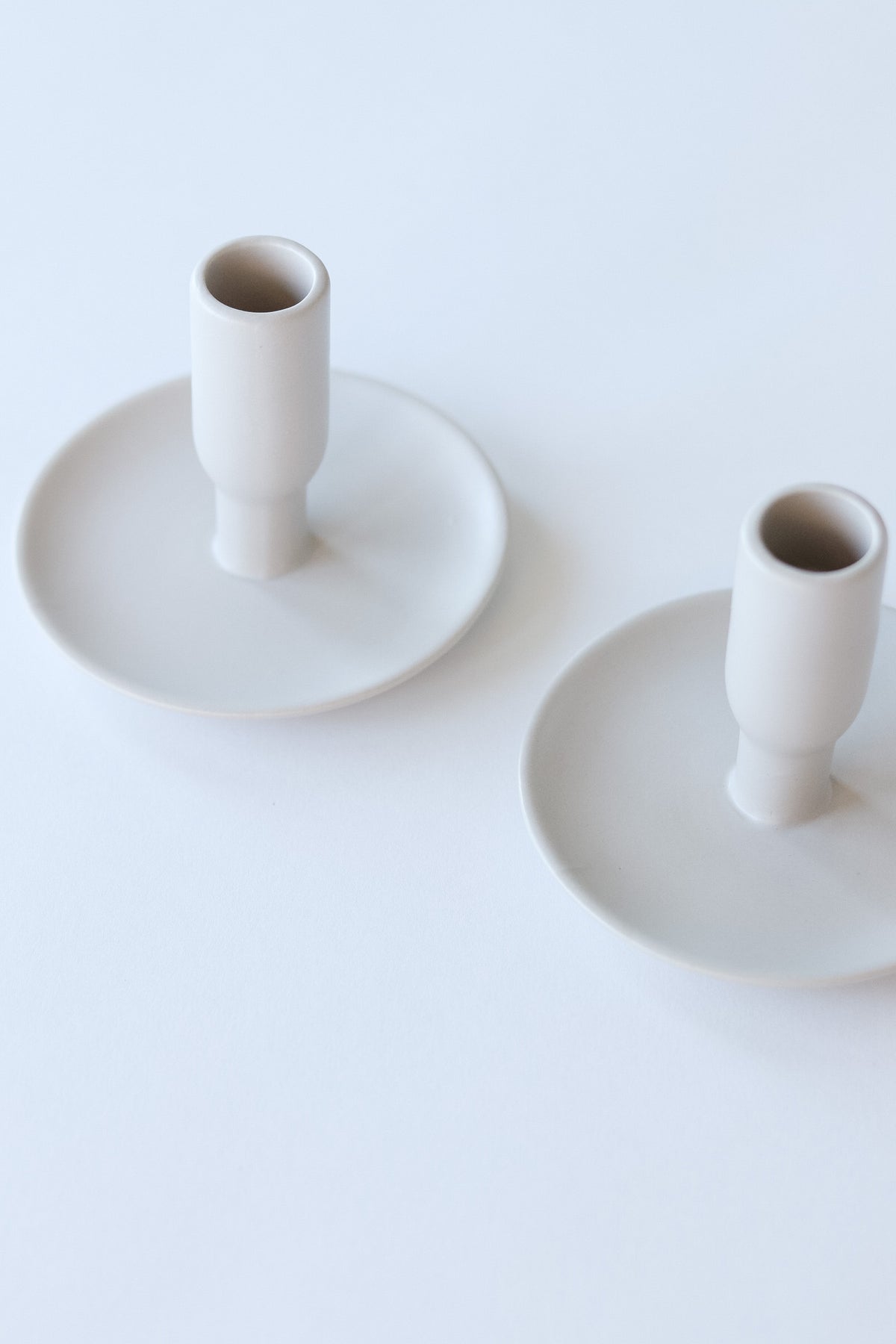 white ceramic candle holders